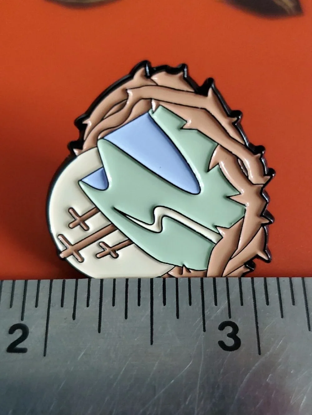 Enamel Pin Featuring Three Crosses and River